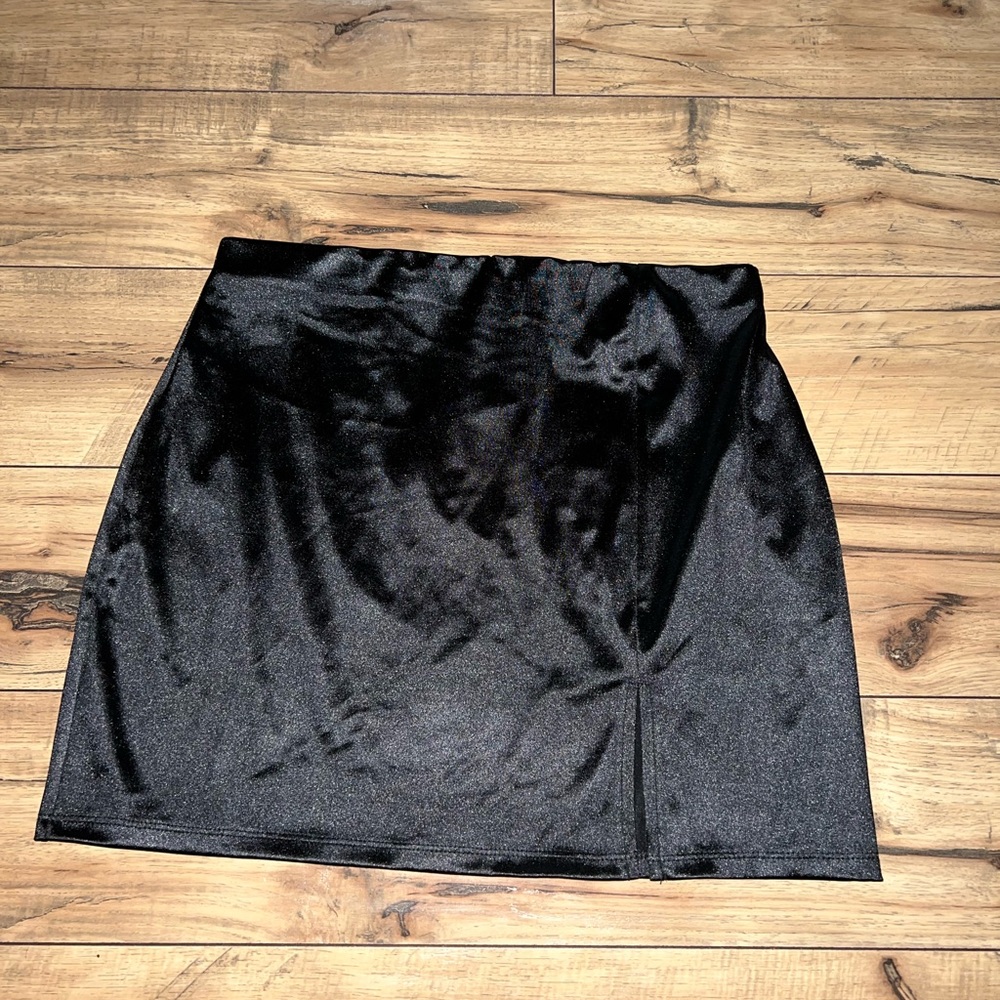 Black silk like skirt.